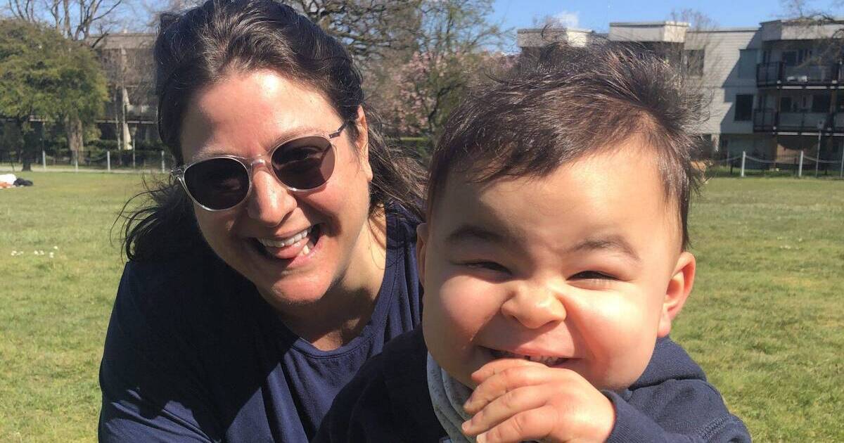 A photo of Amanda and Eli in a park on a sunny day